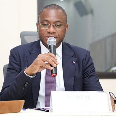 Sidi Tiemoko Toure talking into a microphone at a conference.