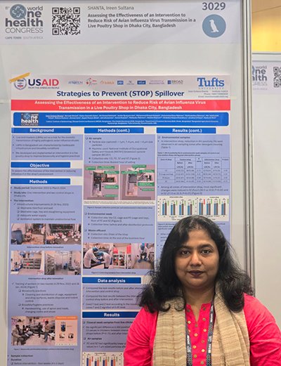 Dr. Ireen Sultana posing with her poster at the conference.