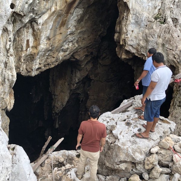 STOP Spillover team member and community representatives at a cave where bat guano collectors harvest guano.